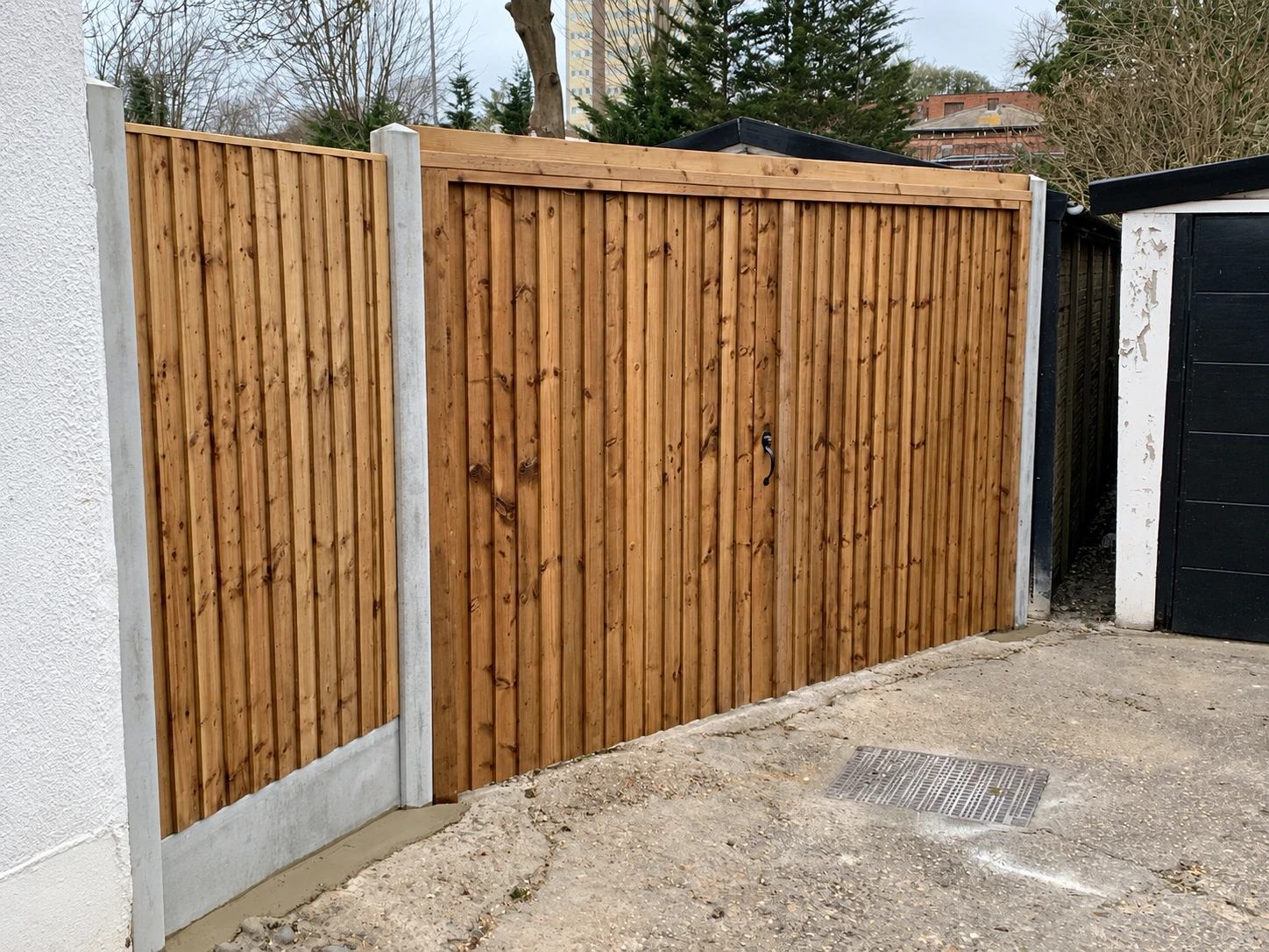 Wide timber gate with a coordinated closeboard finish